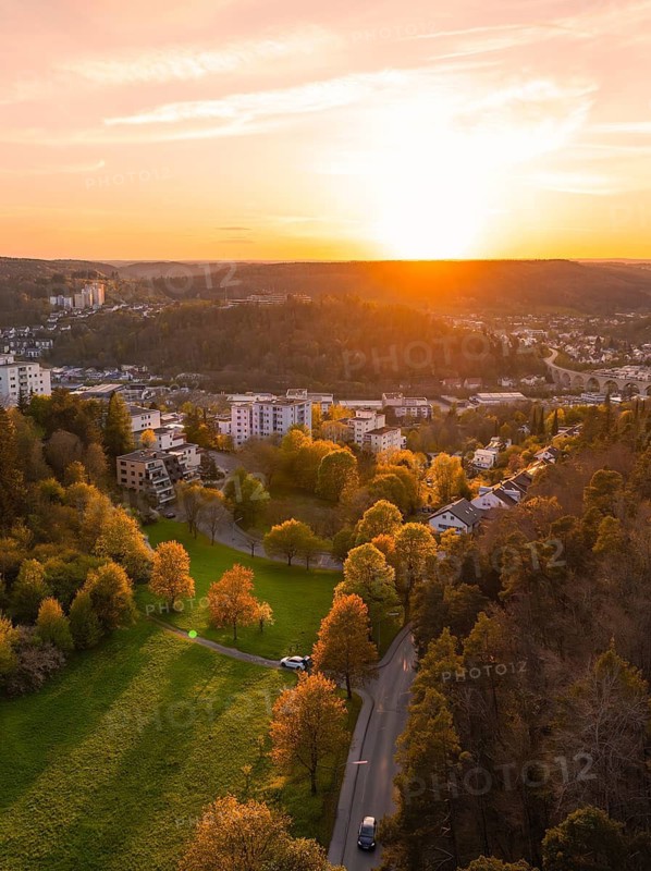 Atmospheric landscape at sunset with avenue and town houses, Nagold, district of Calw, Germany