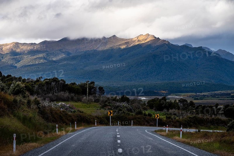 Landscape with mountains and road, Milford Road between Te Anau and Milford Sound. Fiordland National Park, Southland Region, South Island, New Zealand