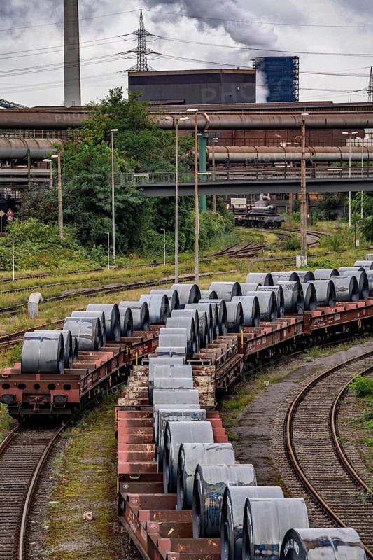Strip steel coils, on freight wagons, at the ThyssenKrupp Steel plant Schwelgern in Duisburg-Marxloh is part of the Bruckhausen steelworks, North Rhine-Westphalia, Germany