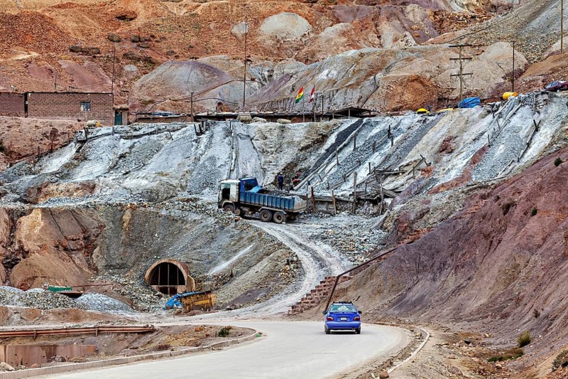 Barren mining scene with gravel roads and trucks on rough terrain, The silver mines of Potosi on Cerro Rico in Bolivia
