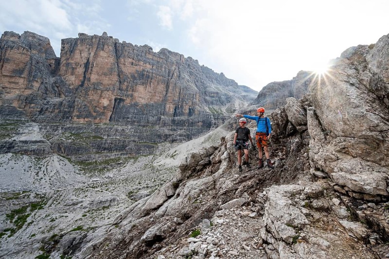 Two mountaineers in rocky mountain landscape, Via Ferrata SOSAT via Ferrata, Sun Star, Brenta Mountains, Trentino, Italy