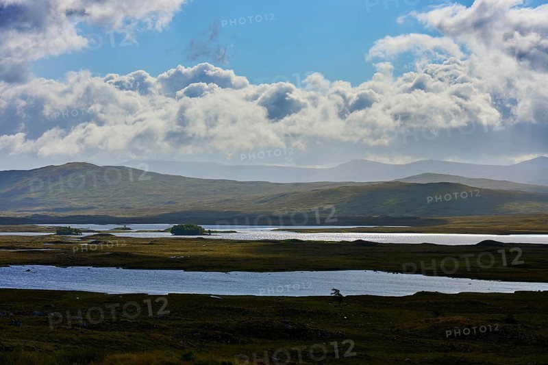 Wide lake landscape under cloudy sky with rolling hills, Rannoch Moor, Bridge of Orchy, Scotland, United Kingdom, Great Britain