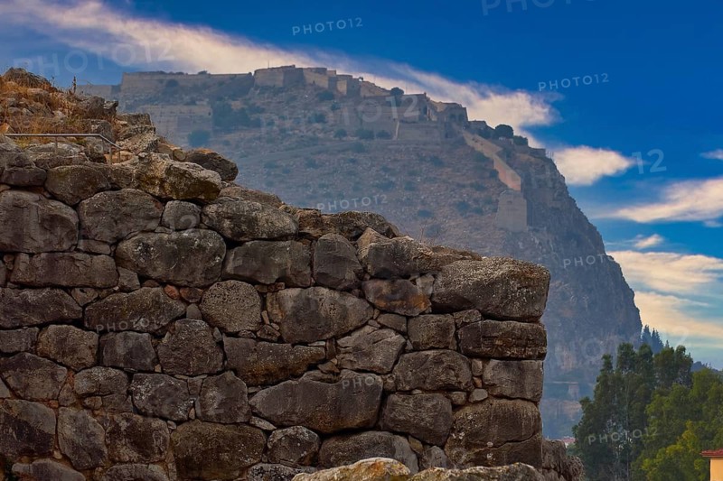 Sky changed, Argos Castle, Larissa Castle, View from Tiryns of an old stone castle in the mountains under a clear blue sky, Tiryns, Ancient City in Argolis, Mycenaean, Peloponnese, Greece