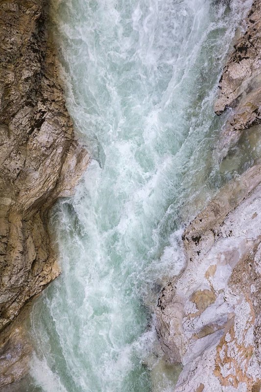 The Lammer creek is flowing fast through the Lammerklamm on a sunny hiking day