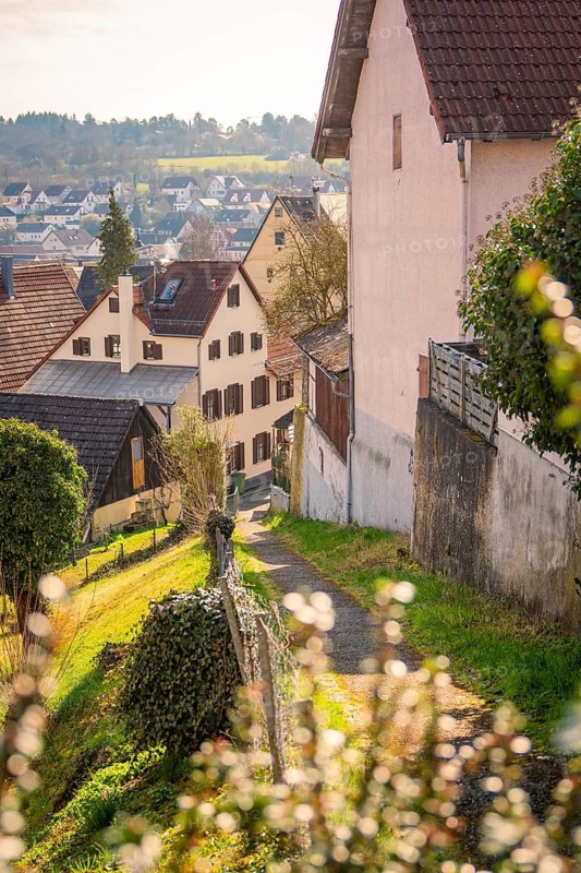 Scenic view of a village in a hilly landscape in golden spring light, Gechingen, Calw district, Germany