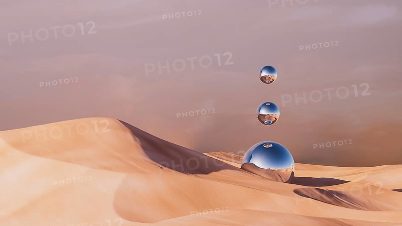 Metallic spheres hover elegantly over soft sand dunes in a surreal desert environment at dusk, creating an otherworldly atmosphere