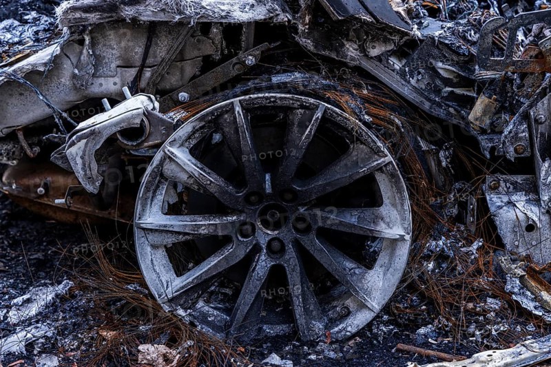 Burnt out Jaguar car on the side of the road, Mitte, Berlin, Germany