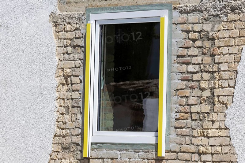Newly installed window in an old building