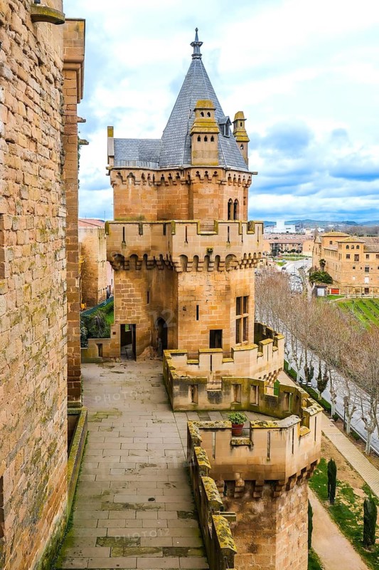 Majestic medieval royal palace of olite, featuring impressive towers and fortified walls, overlooking the charming town in navarre, spain