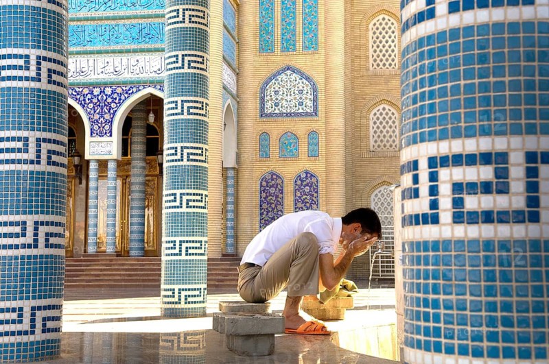 Erbil, Iraq, September 30th 2009. A Muslim man does Wudu, an Islamic ritual before prayers at Grand Mosque Erbil, North Kurdish region of Iraq
