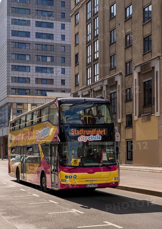 Sightseeing bus during its sightseeing tour in Berlin City East, Berlin, Germany