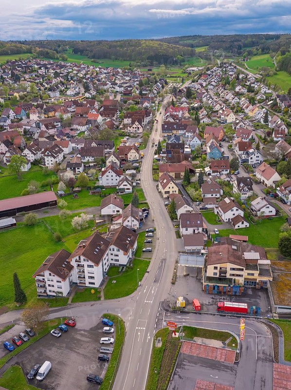 Central road network of a village with roundabout, surrounded by groups of buildings, Ostelsheim, district of Calw, Germany