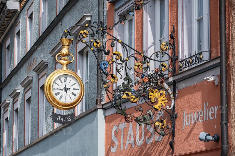 Traditional guild signs for watchmakers, nose sign with an oversized, gold pocket watch with Stauss lettering, a jewelry store in the historic old town of Rottweil, Rottweil district, Baden-Württemberg, Germany