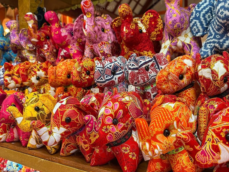 Vibrant display of intricately patterned elephant plush toys, showcasing traditional Thai designs and colors. Perfect souvenirs that capture Thai culture and craftsmanship