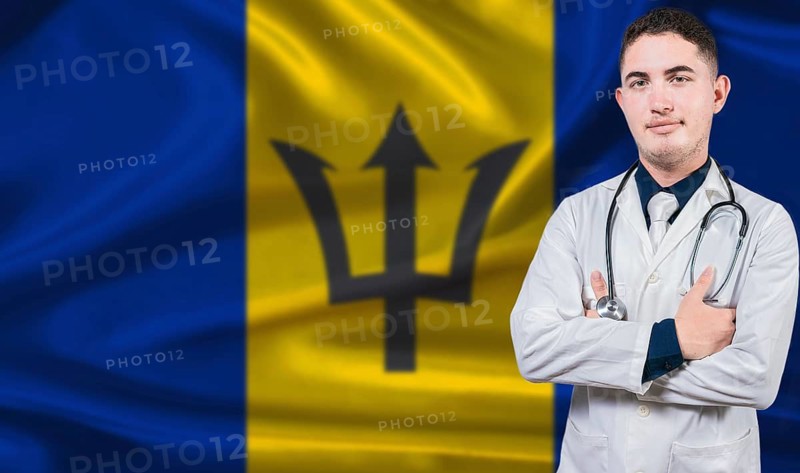 Portrait of medical professional on Barbados flag background. Barbadian national health system