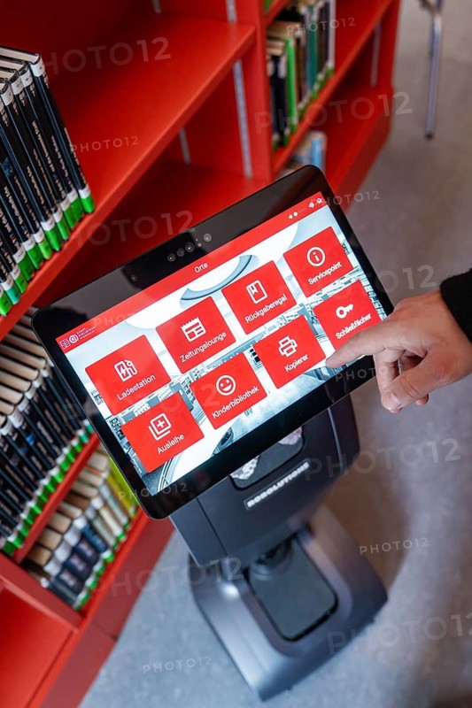 An interactive display shows various options in the library environment, Interactive guided tours by robots Personalities from Robolutions, Pforzheim, Germany