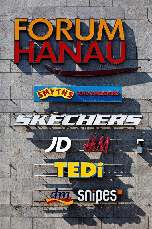 Façade of Forum Hanau with company logos at the shopping centre, Freiheitsplatz, Hanau, Hesse, Germany