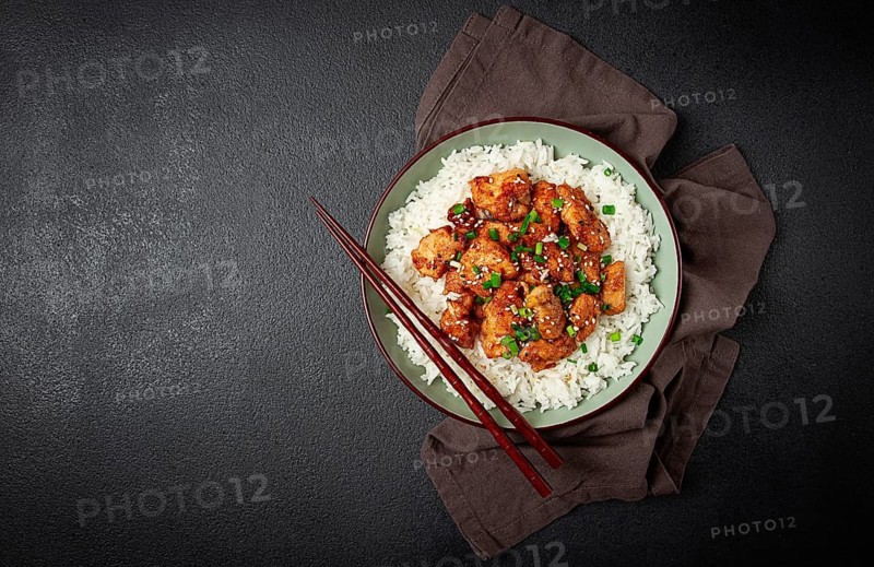 Fried chicken teriyaki with rice, green onion and sesame, homemade, no people