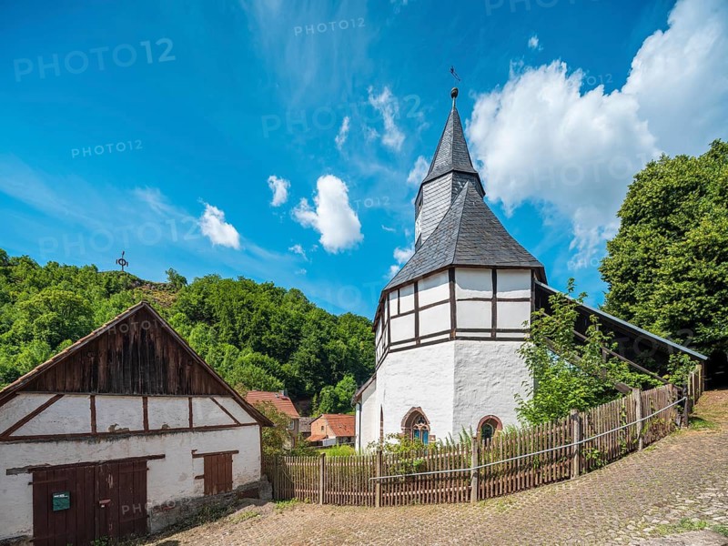 The small half-timbered church of Questenberg in the Harz Mountains, the quest on the horizon, remnants of pre-Christian customs in the karst landscape of the Southern Harz, Saxony-Anhalt, Germany