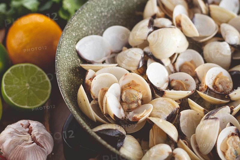 Cooking, vongole clams, in a pan with spices and white wine, top view, no people