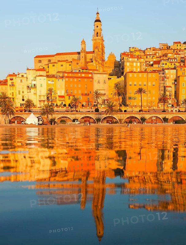 The town of Menton reflected in the sea, Menton, Côte d'Azur, Provence, France