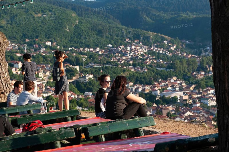 Sarajevo, Bosnia. July 25th 2019 Tourists watch the sunset from the terrace of the Park Princeva Restaurant on the hill above Sarajevo, Bosnia and Herzegovina