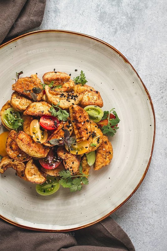 Salad, crispy eggplant in batter, with cherry, sesame seeds, olive oil, homemade, no people