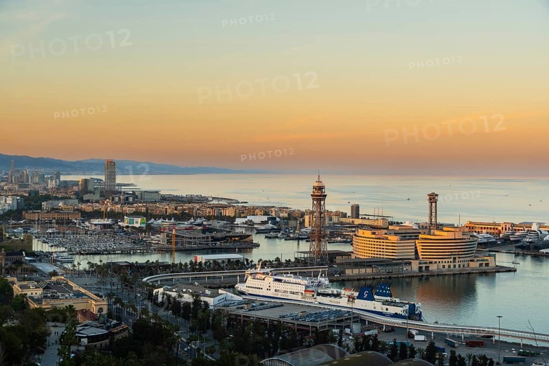 View of the old harbour and the city of Barcelona in the evening light, Spain