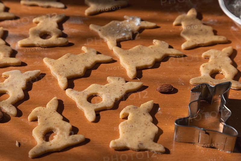 Cut out bunny cookies and a cookie cutter for Easter