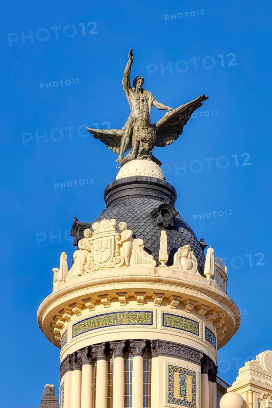 Neoclassical architecture with winged statue on a decorated building, Cordoba
