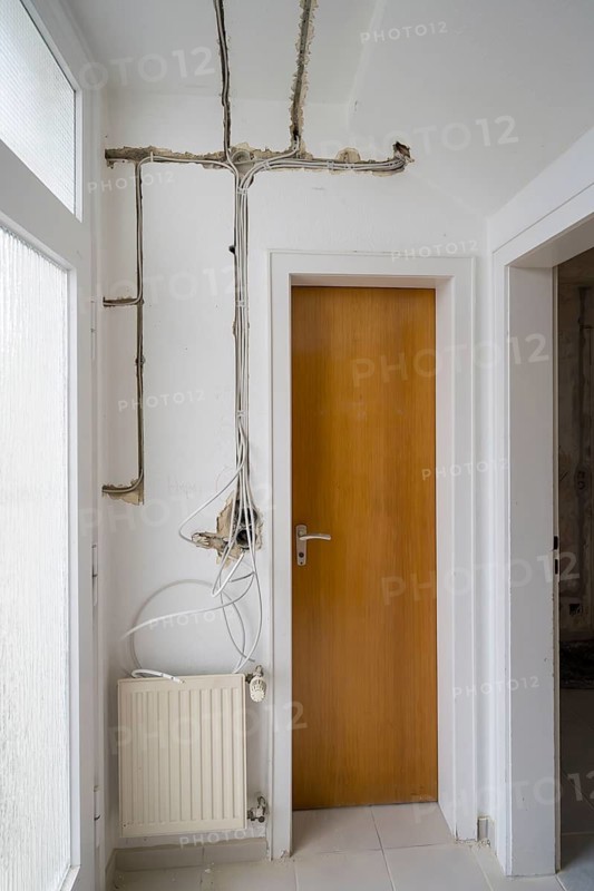 Apartment is being renovated, slots for electrical lines, unplastered exposed sockets, old building, North Rhine-Westphalia, Germany