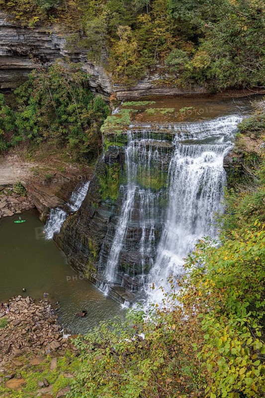 Swimmers and paddleboarder at the base of Burgess Falls along the River Trail, Falling Water River, Burgess Falls State Park near Sparta, Tennessee USA