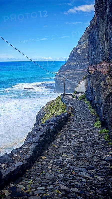 Narrow stone trail, volcanic stone hiking trail along high cliffs with sea views, hiking, Marinha da Cruzinha Natural Park, Santo Antao, Cabo Verde, Cape Verde, Cape Verde