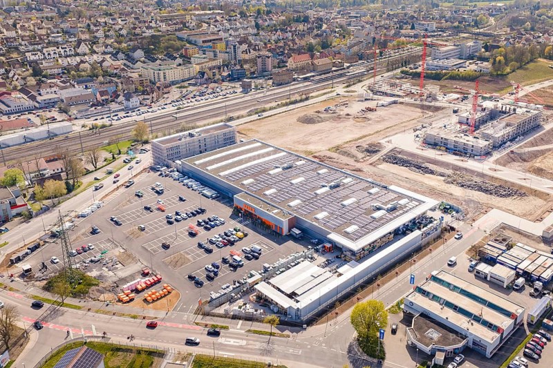 Industrial area with construction work and large buildings with solar panels, PV plant at Obi Baumarkt, Mühlacker, Enzkreis, Germany