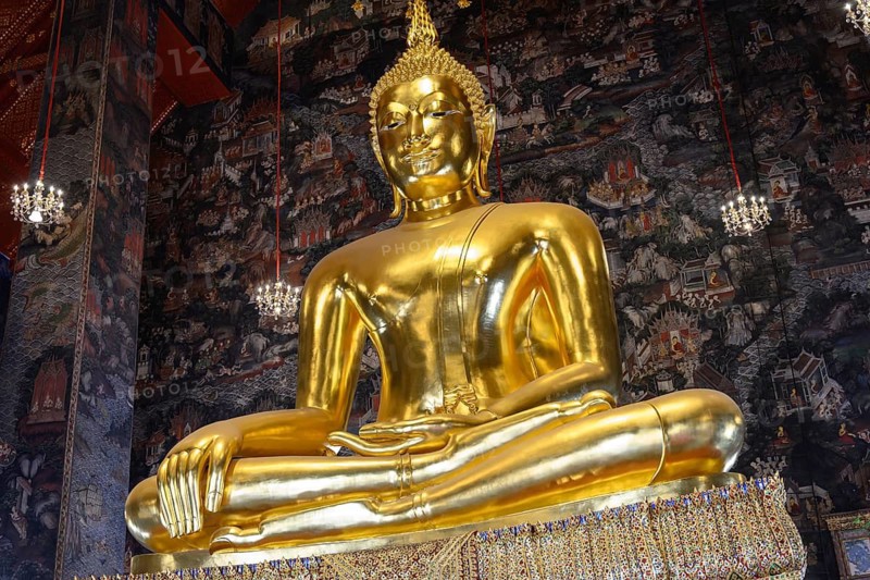 Bangkok, Thailand. February 20th 2025. Beautiful view of gilded Buddha statue among amazing murals in Wat Suthat Thepwararam. The Buddhist temple is a popular tourist attraction of Bangkok, Thailand