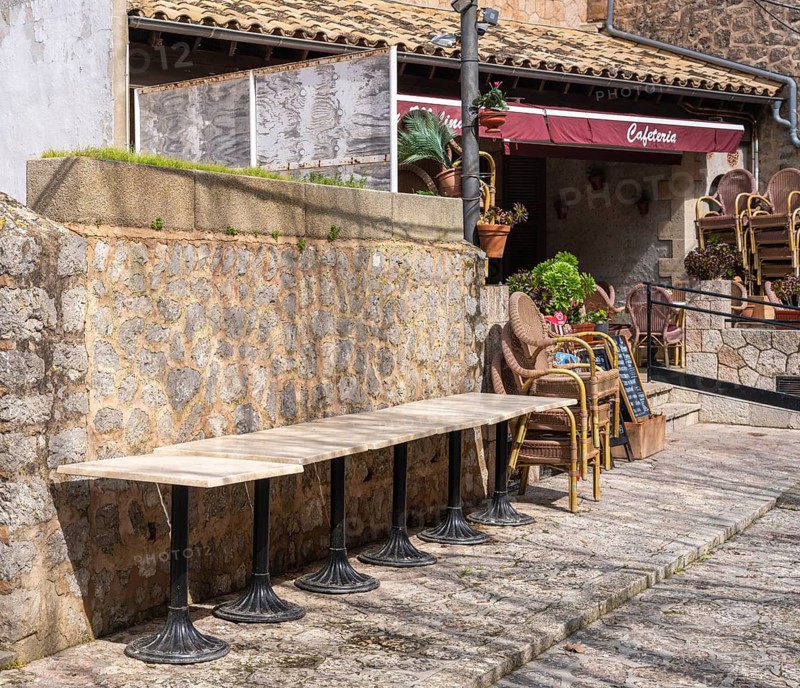 Small alleys with cafes, restaurants and fashion stores in the picturesque mountain village of Valdemossa, Majorca, Balearic Islands, Spain