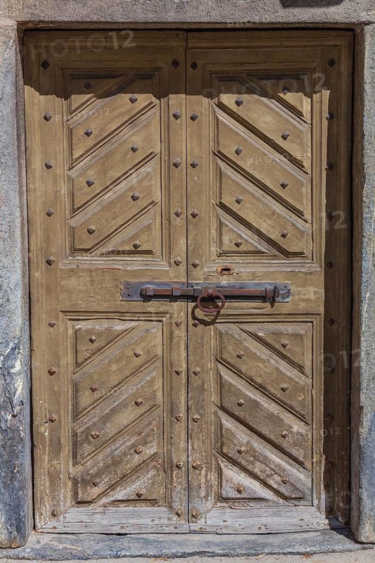 Old wooden door. Historical centre, Chiavenna, Valtellina, Lombardy, Italy