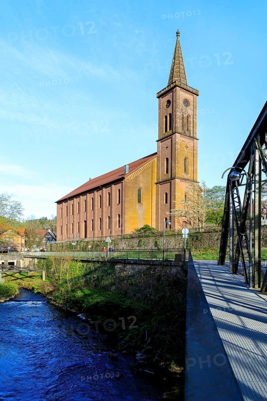 Kinzig and town church with steel girder bridge in Schiltach, Black Forest, Baden-Württemberg, Germany