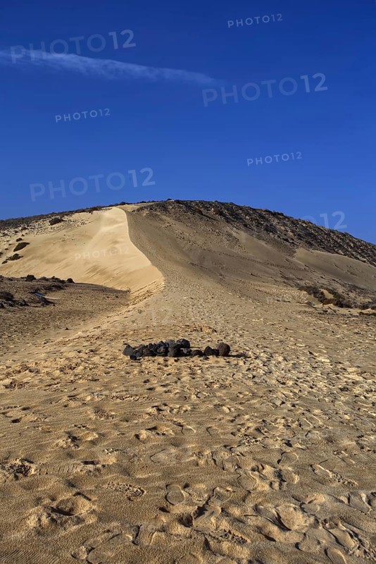 Sand dune under a clear blue sky, Pajara, Fuerteventura, Canary Islands, Spain