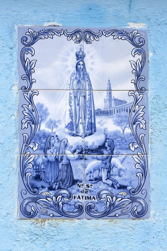 Tile with a religious motif in a house wall, Burano, Veneto, Italy