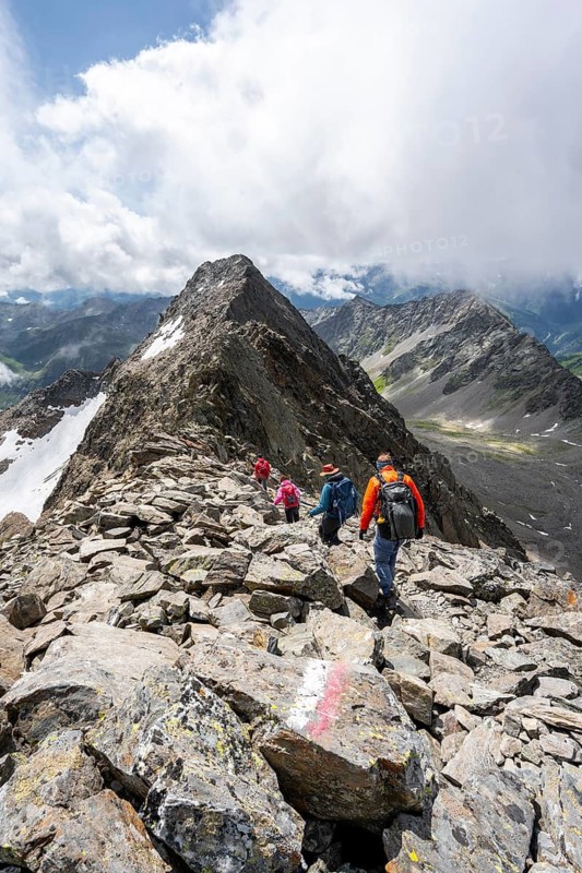 Group of mountaineers on the summit of Lasörling on the descent, Lasörling Group, Hohe Tauern National Park, East Tyrol, Tyrol, Austria