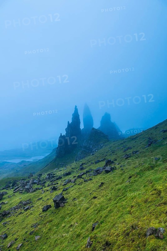 UK. Scotland. Isle of Skye. The Old Man of Storr covered in mist during a storm