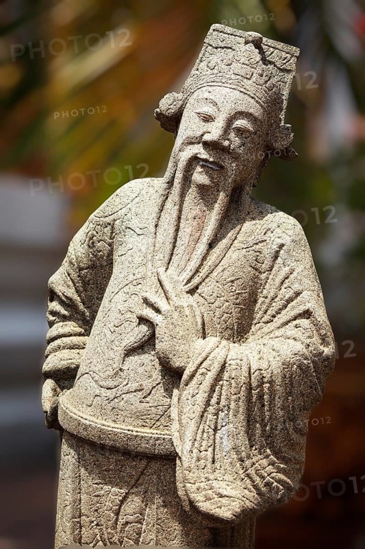 Chinese stone guardian statue in Wat Pho Buddhist Temple, Bangkok, Thailand