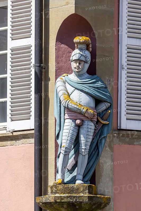 Town view of Schwäbisch Hall. Knight figure with genital protection on a building facade. Schwäbisch Hall, Baden-Württemberg, Germany