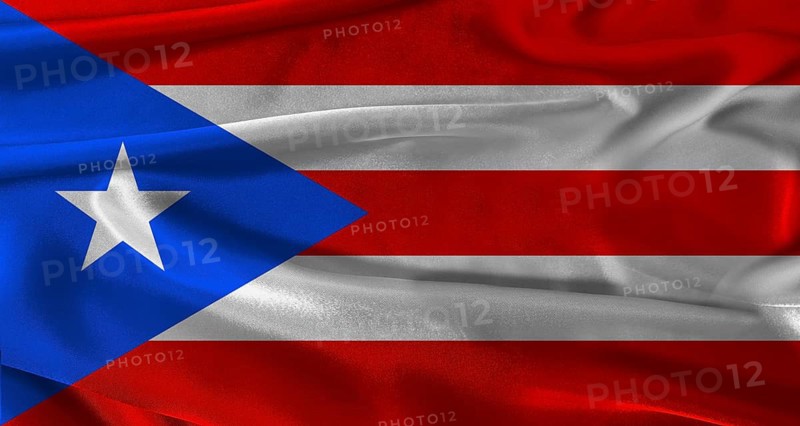 Flag of Puerto Rico with fabric textured background. Close up of National flag of Puerto Rico with realistic texture