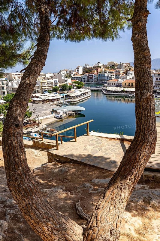 The village of Agios Nikolaos, in the eastern part of Crete, view over Lake Voulismeni, connected to the sea, old town, Greece