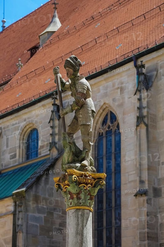 Georgsbrunnen, Jörgenbrunnen at Holzmarkt, stone figure, dragon, St George, patron saint of the collegiate church, at the back of the collegiate church of St George, Protestant parish church, place of worship, sacred building, historic old town, university town, Tübingen, Baden-Württemberg, Germany