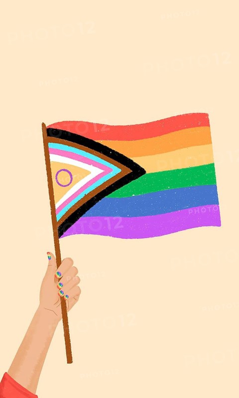 A vibrant Pride flag is held aloft by a hand with painted nails, symbolizing diversity and inclusivity. The flag waves against a warm, neutral background