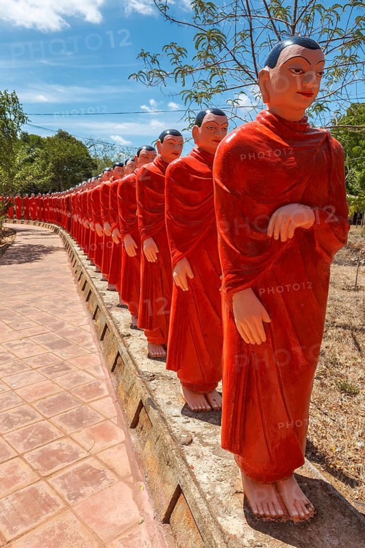 ANURADHAPURA, SRI LANKA, SEPTEMBER 26, 2009: 500 statues of Buddhist monks (Arahants) in Nellikulama Temple walking after Buddha