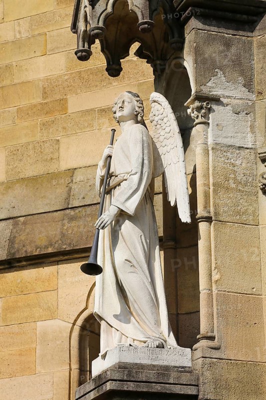 Cemetery Unter den Linden, neo-Gothic St Catherine's Church, church, sacral architecture, angel figure with wings and wind instrument, sculpture, stone figure, Reutlingen, Baden-Württemberg, Germany